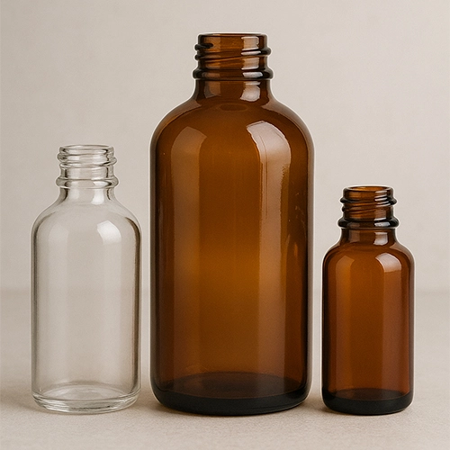 Redex Glass amber and clear Boston round glass bottles, ideal for essential oils and pharmaceuticals.
