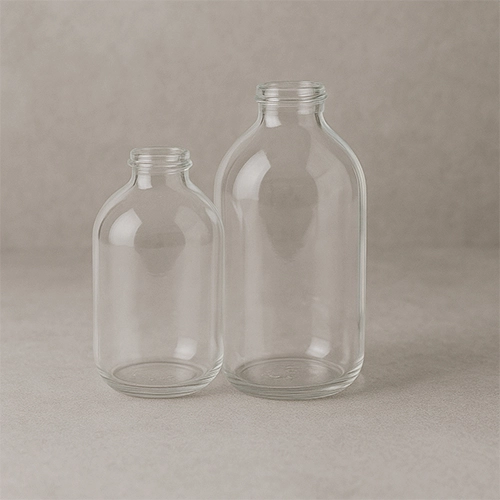 Redex Glass clear infusion bottles in two different sizes, ideal for pharmaceutical use.