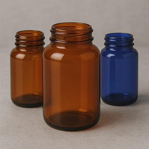 Redex Glass amber and cobalt blue tablet bottles, ideal for supplement and pharmaceutical packaging.